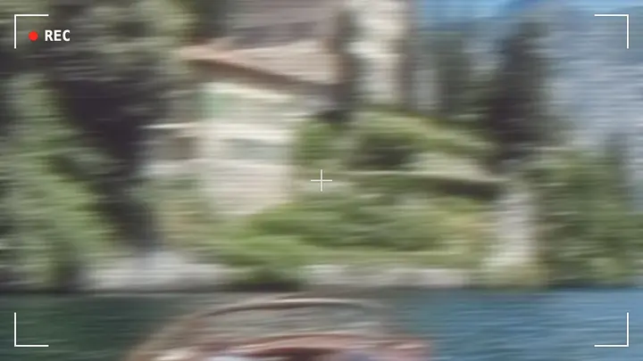 Viewfinder corners overlay over a VHS-look clip